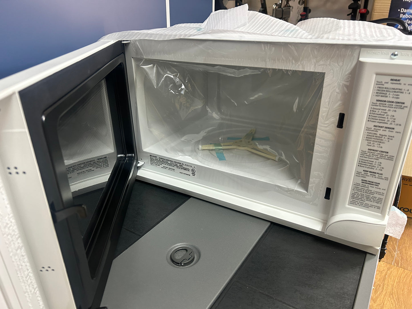 Sharp - R-1211 - 24 Inch Wide 1.5 Cu. Ft. Over-the-Counter Microwave with Task Lighting