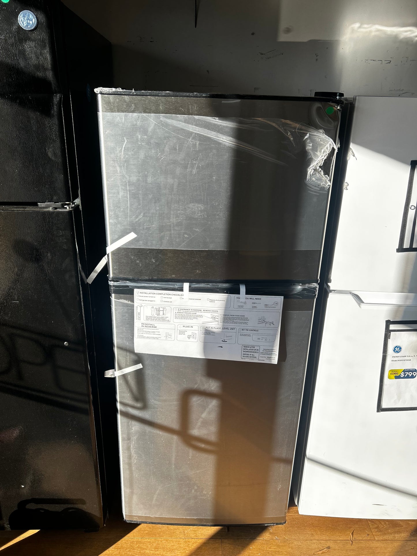 GE - GPE12FSKSB - 24 Inch Top-Freezer Refrigerator with 11.6 cu. ft. Capacity, LED Interior Lighting, Electronic Temperature Controls, 2 Shelves, 2 Drawers, 3 Door Bins, ADA Compliant and Energy Star Qualified: Stainless Steel