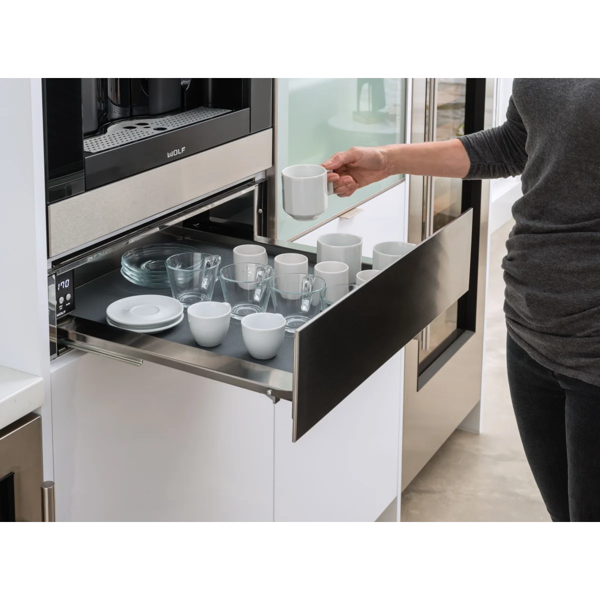 Wolf - EC24S - 24 Inch Built-in Coffee System with Adjustable Grinder, Auto On/Off, Descaling, Hot Water Dispenser, Removable Milk Carafe, Mounted Glide System and Non-Plumbed: Stainless Steel